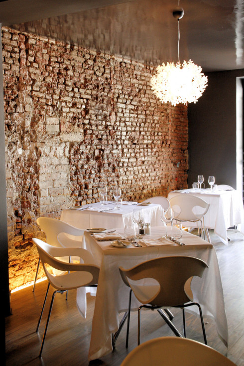 The interior at Bizerca, with their signature exposed brick wall and butterfly details.