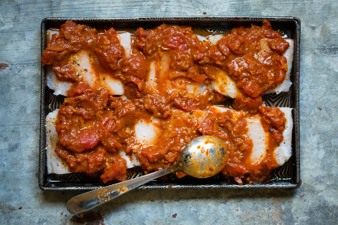 Hake fillets with a spicy tomato sauce, ready to to into the oven (photography by Tasha Seccombe)