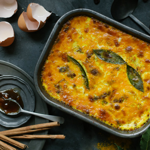Fragrant spiced beef mince baked with raisins, bay leaves and a savoury custard topping (photography by Tasha Seccombe)