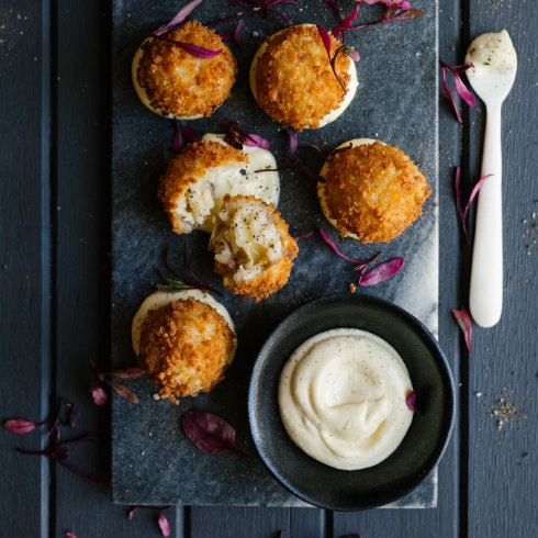 Golden deep tried stuffed nuggets of risotto served with garlic mayo (photography by Tasha Seccombe)