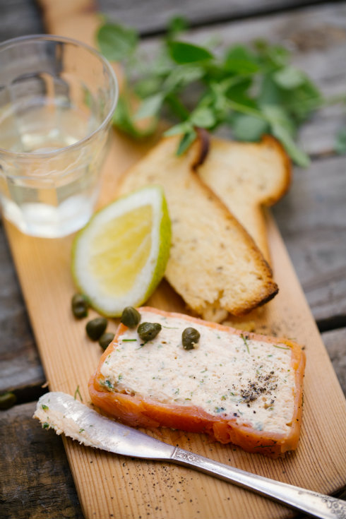 A slice of pale coral trout terrine and melba toast (photography by Tasha Seccombe)