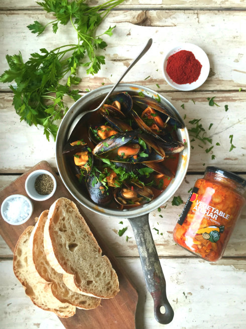 Spicy black Saldanha Bay mussels with garlic, paprika, and white wine.