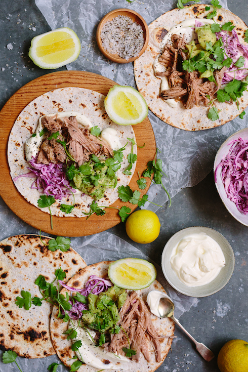 Easy BBQ pulled pork tortillas with sour cream, red cabbage slaw, avo and fresh coriander. So delicious! (photography by Tasha Seccombe)